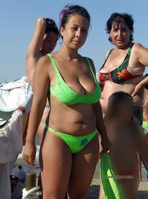 Cute latina mature lady on the beach.